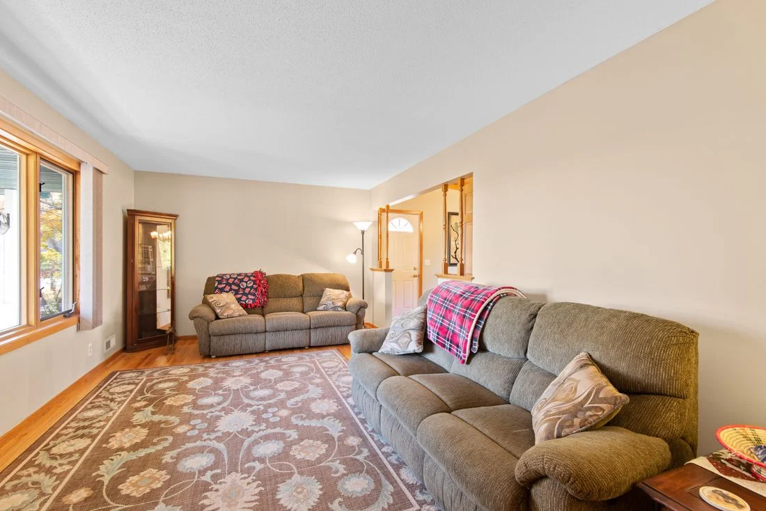 Two upholstered sofas facing into the same room