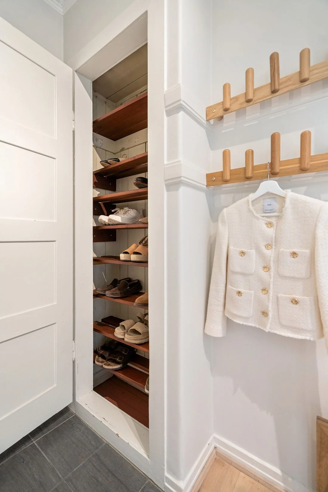 Open wardrobe with organized shoes
