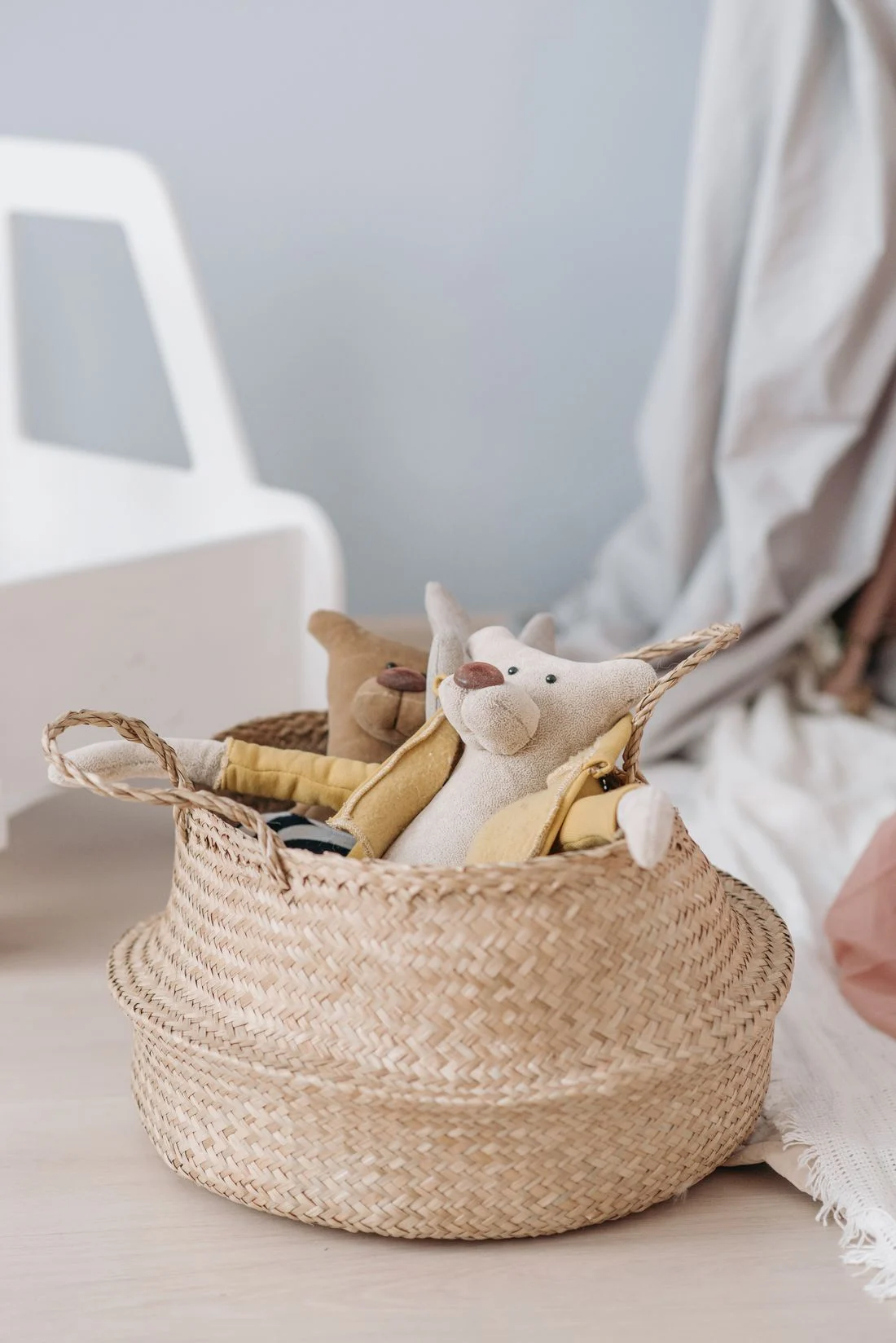 Stuffed toys in a woven basket