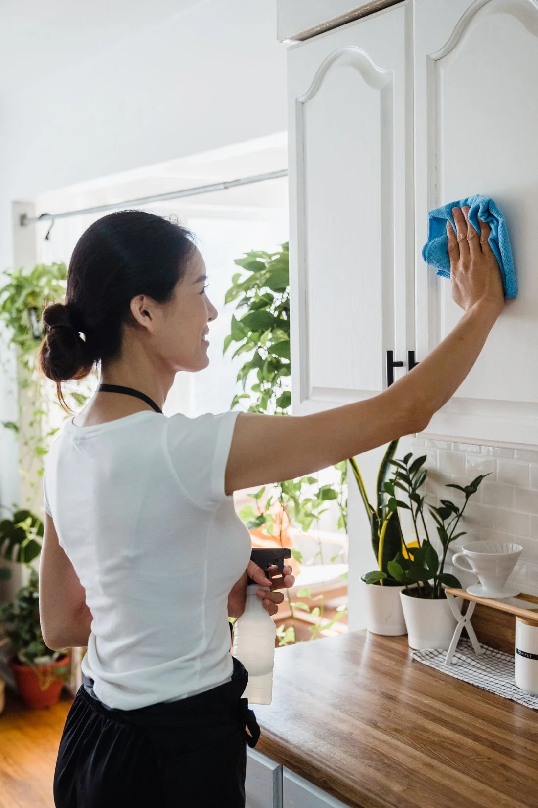Cleaning a kitchen cabinet surface