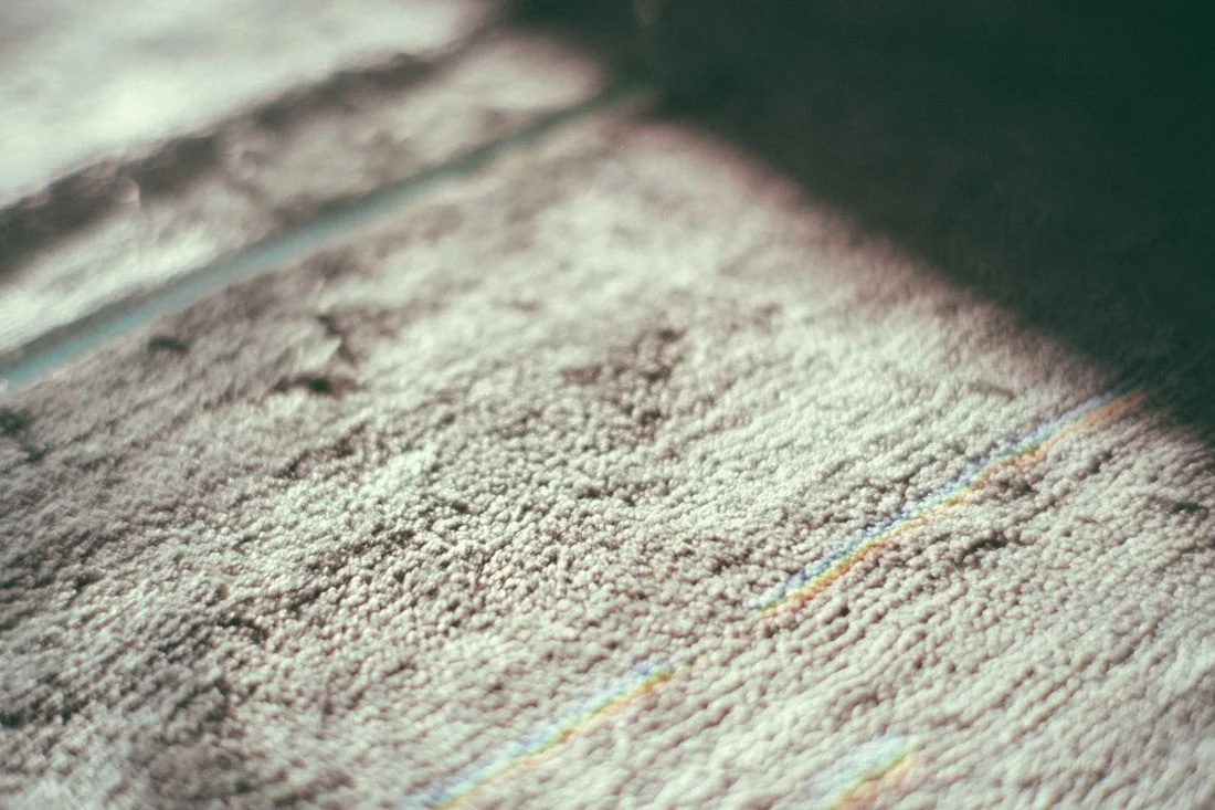 Close view of a textured rug in sunlight