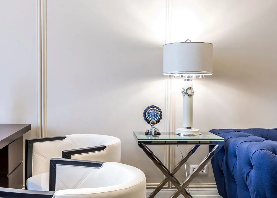 Table lamp beside a living room armchair