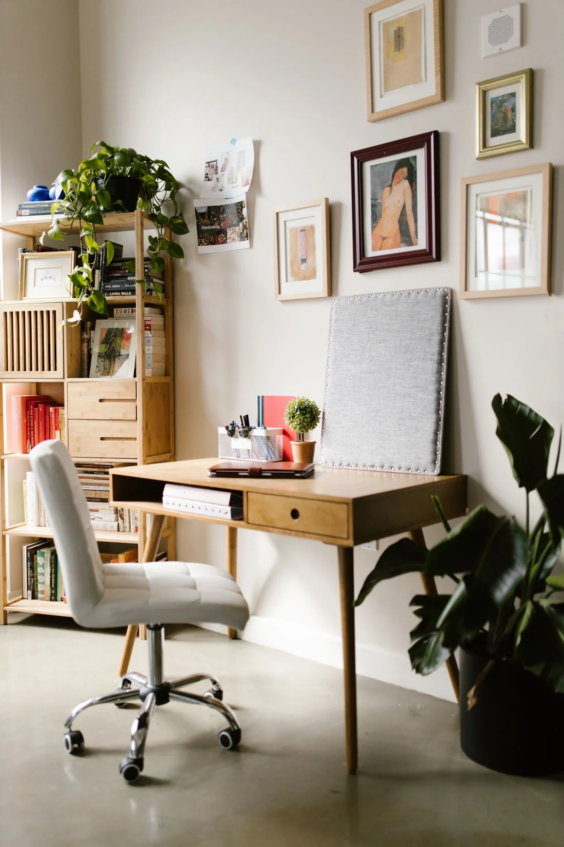 Framed pictures over a home office desk