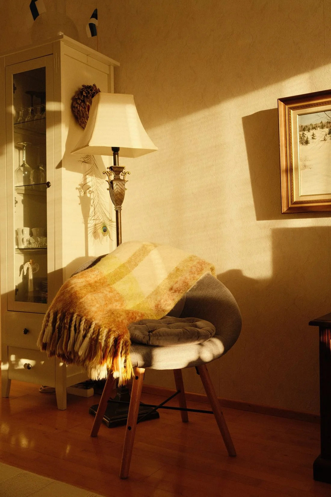 Blanket draped over a chair near a lamp