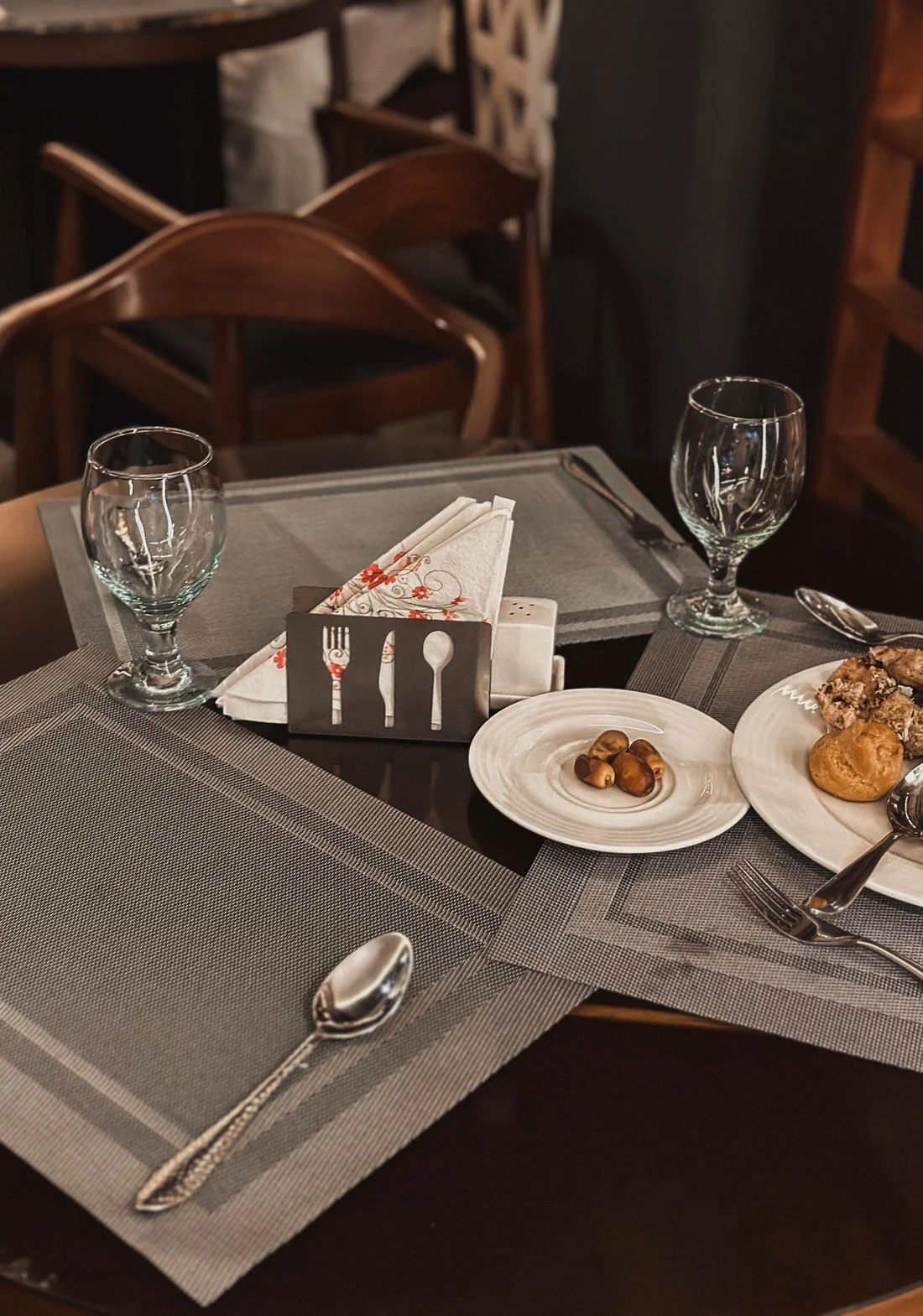 Dining table with glasses and placemats