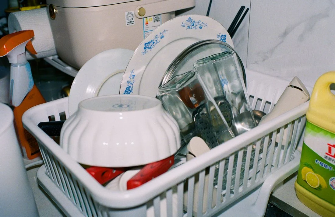 Clean dishes and glasses in a drying rack