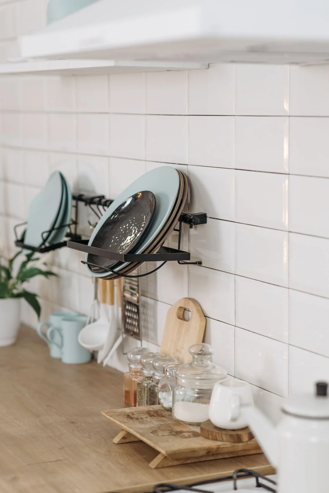 Kitchen counter with plates and storage jars