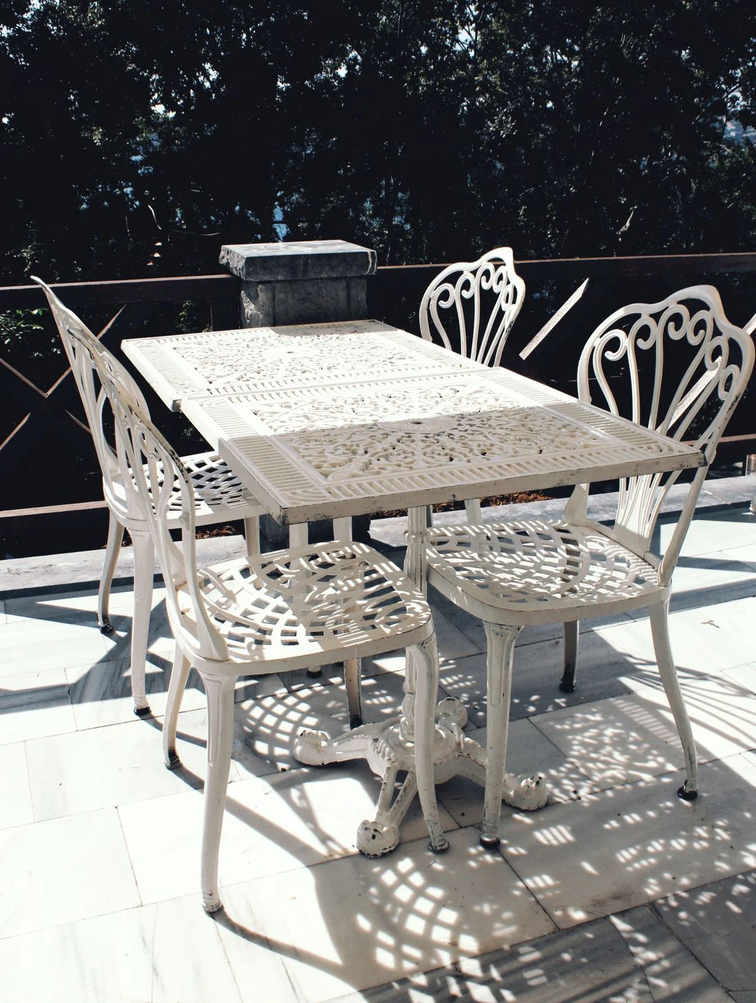 White metal outdoor table and chairs